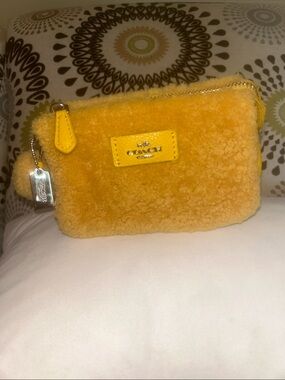COACH Yellow Shearling Wristlet Pouch
